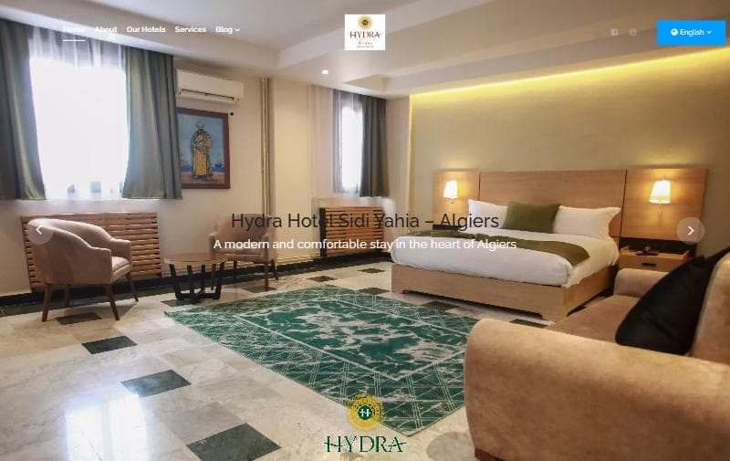 The Hydra Hotels homepage in English, showing the navigation, language switcher and hero image of a room at the Sidi Yahia property